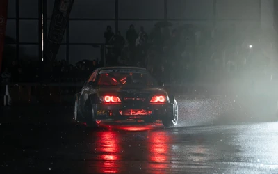Drift-Event mit einem schwarzen Sportwagen bei Tuning World 2026