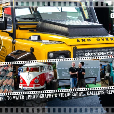 Gelbe Offroad-Fahrzeug mit Dachtr&auml;ger in einer Messehalle.