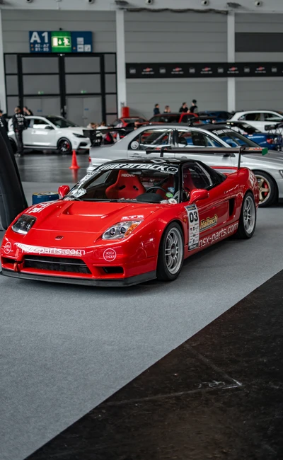 Roter Sportwagen an einem Messestand auf der Tuning World Bodensee 2026